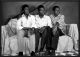 Phillipe Koudjina-Trios jeunes hommes sur canape/Three Young Men on a Couch