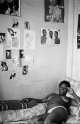 Ruth Motau-A woman relaxing on a bed after a long day, Alexander Hostel